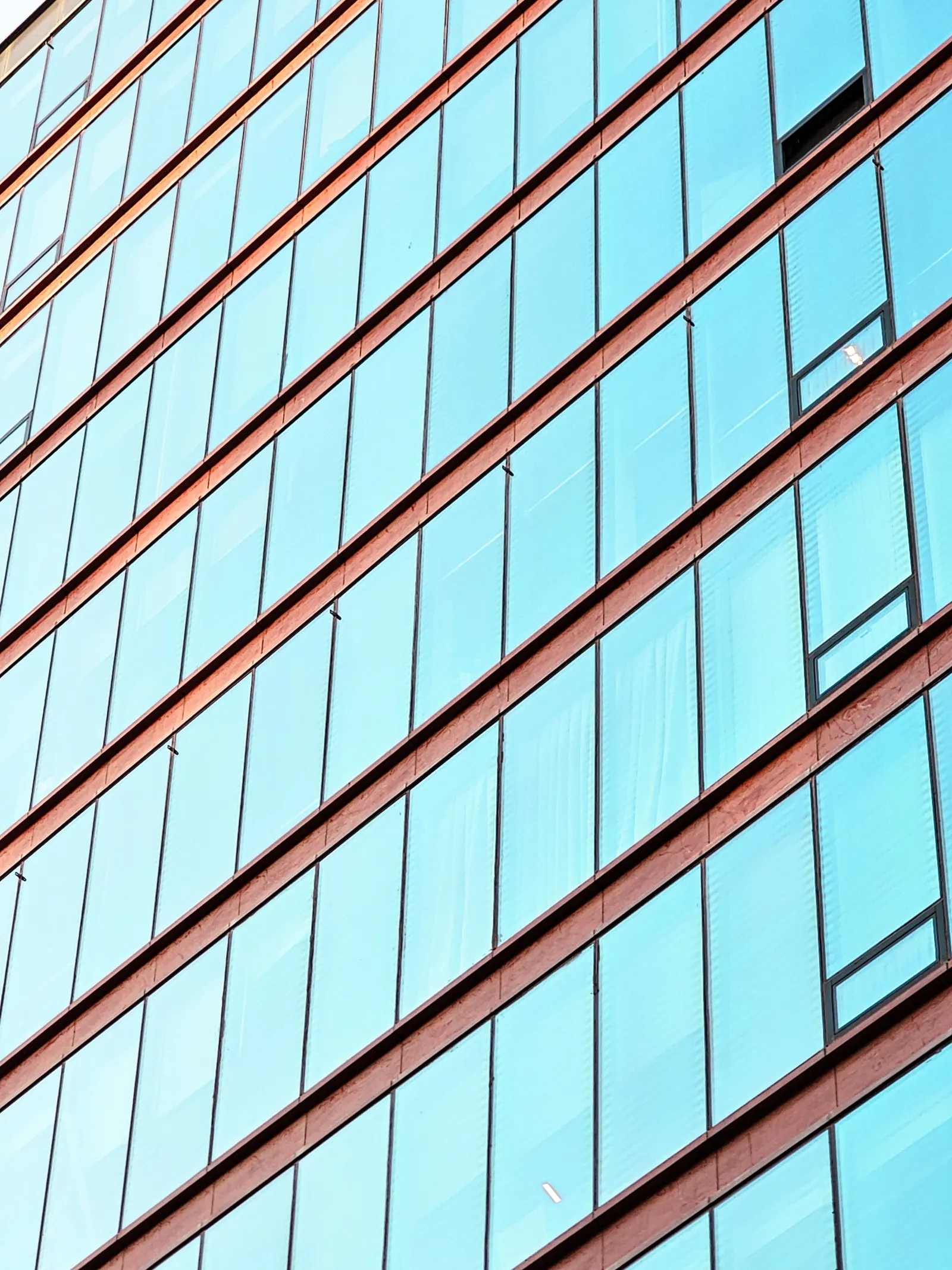A detail of diagonal glass facade panels