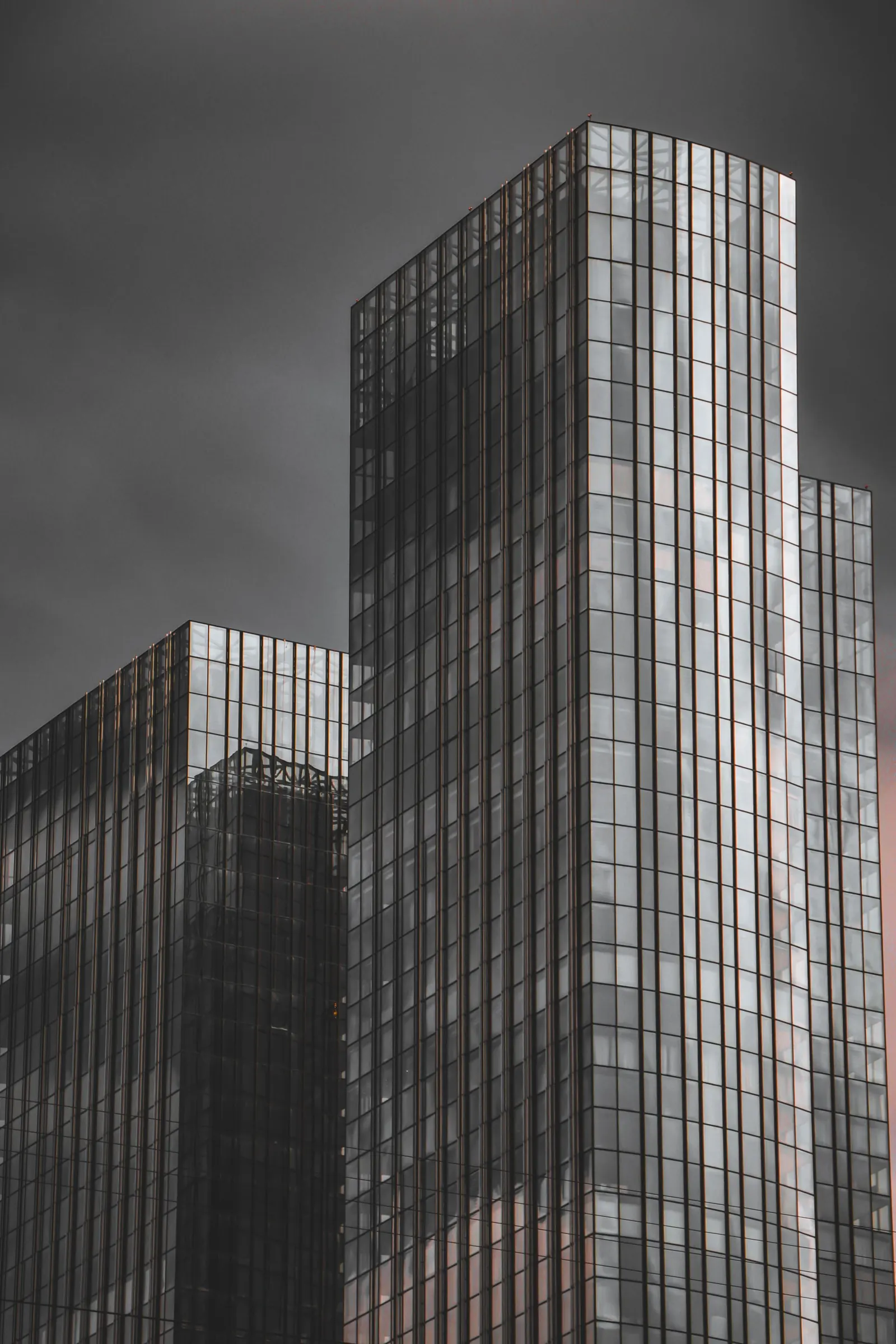 A monochrome view of a tall glass tower