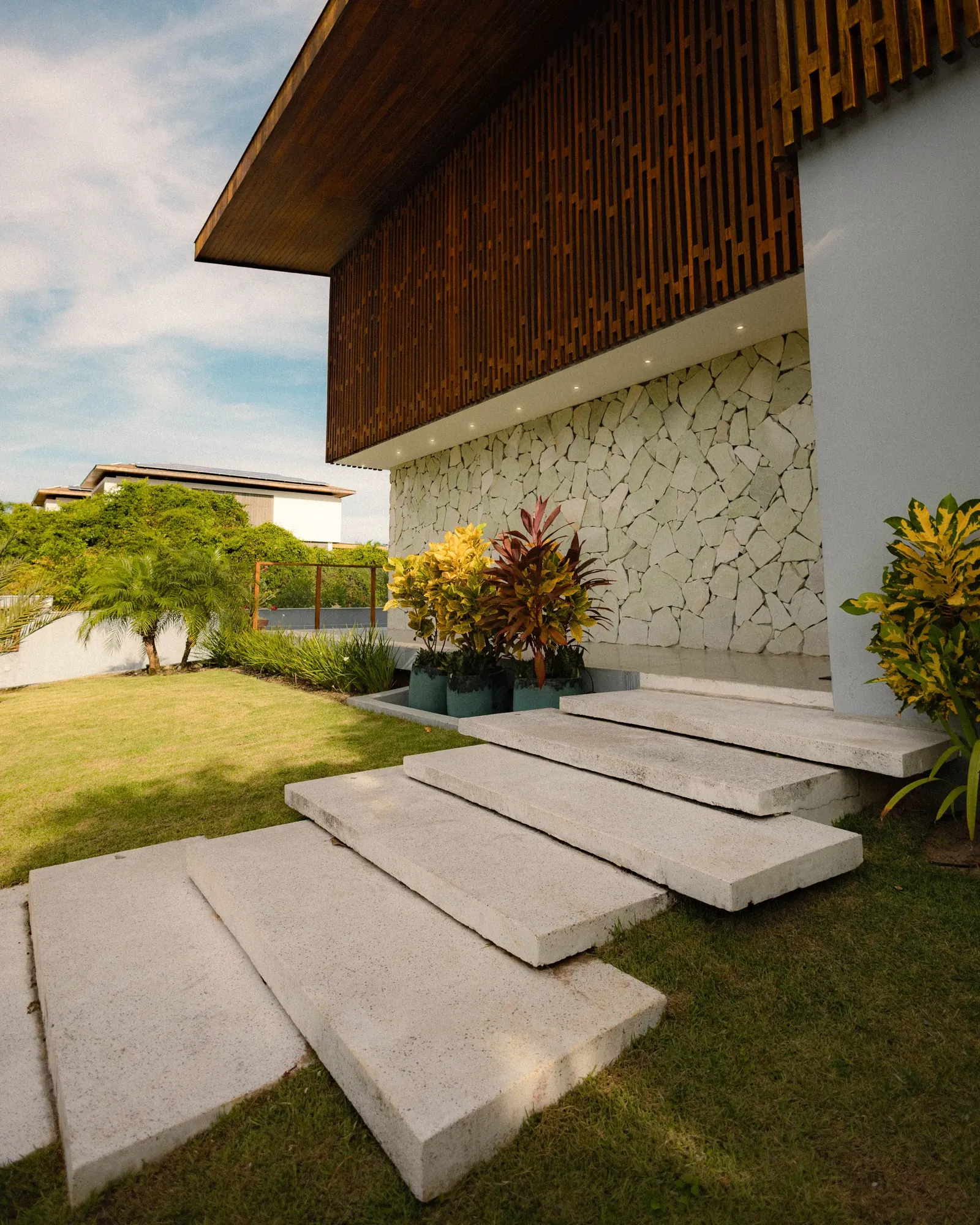 A modern house with a garden and pool