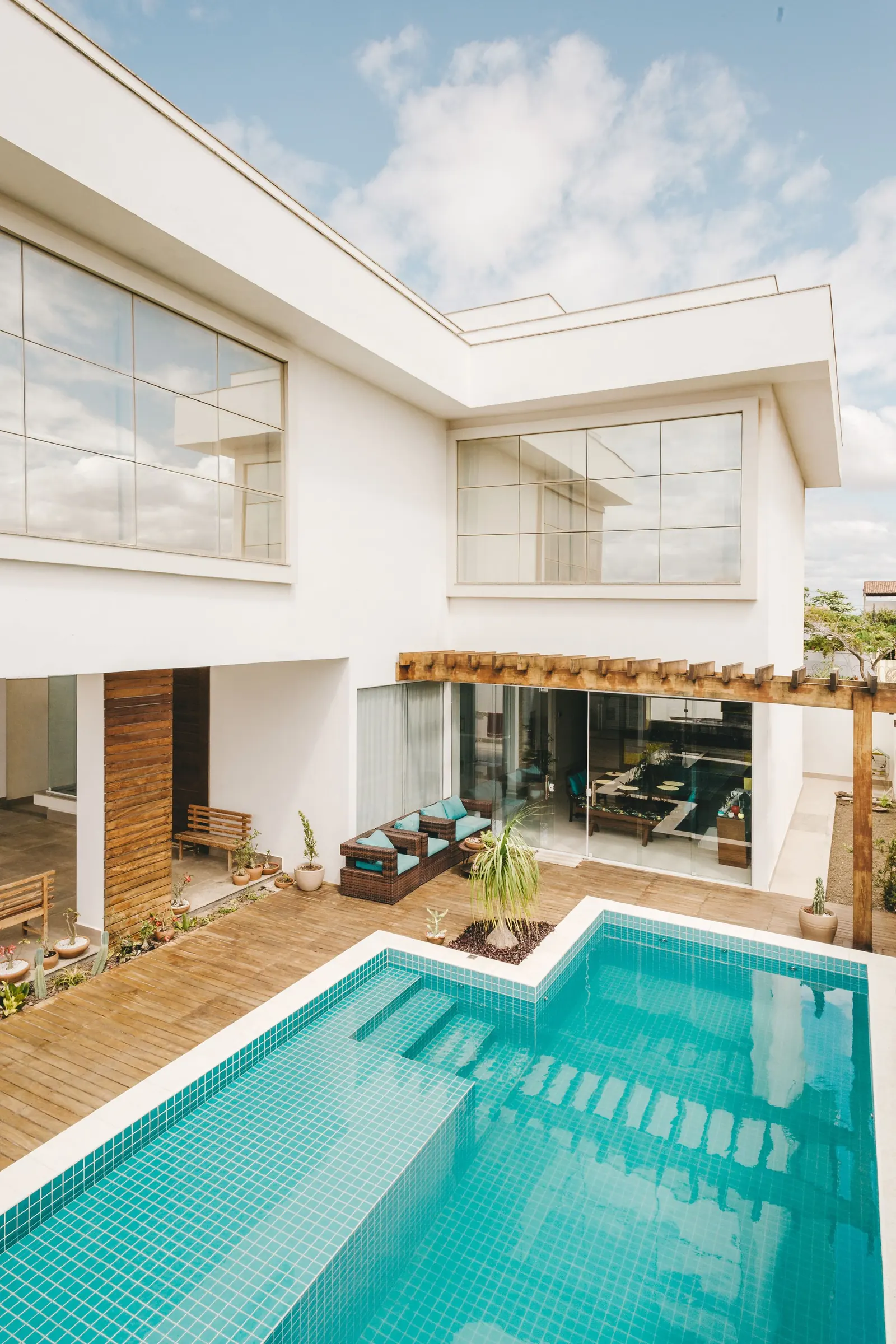 A pool terrace beside a modern house